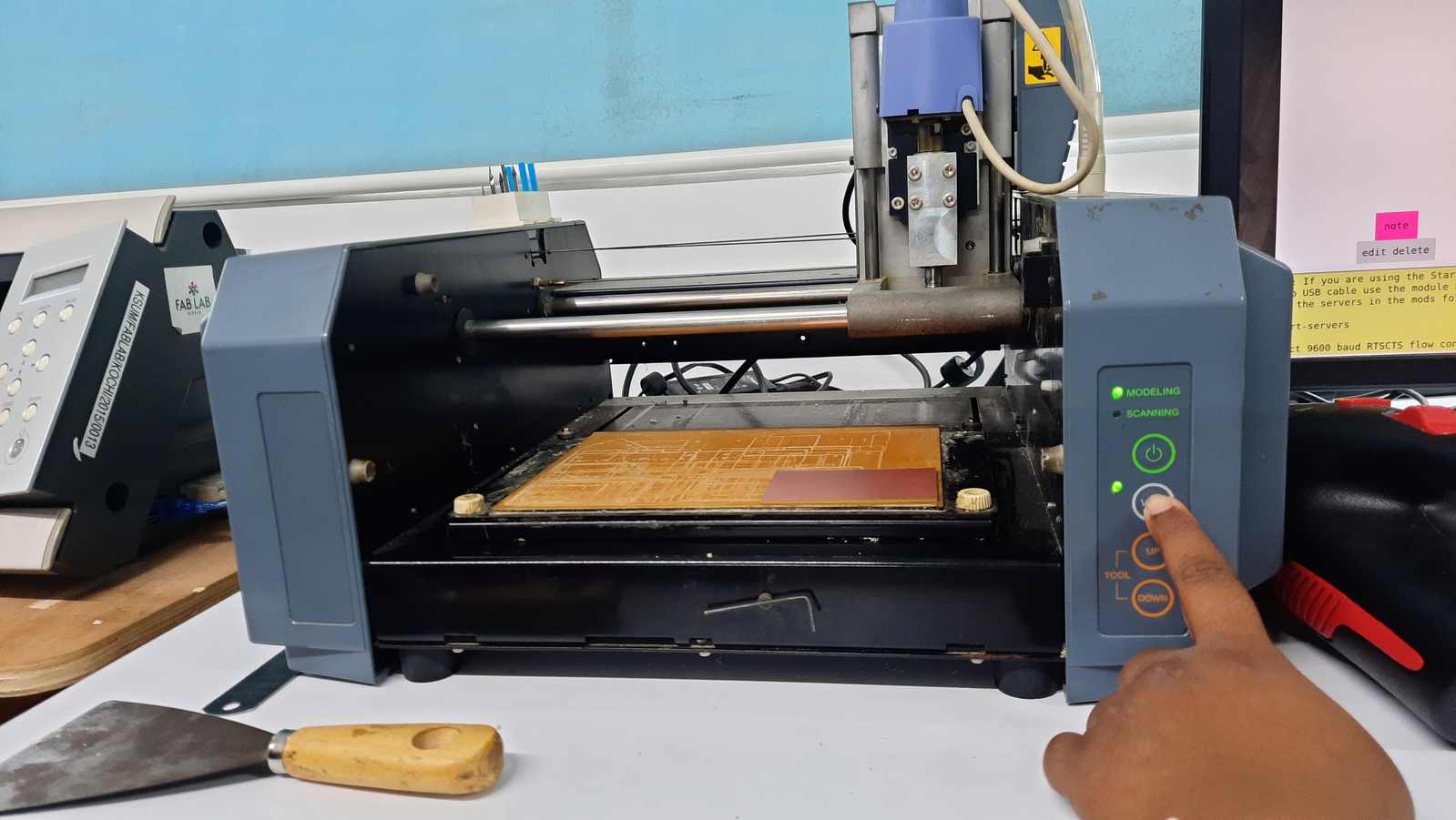 Place the board on the machine bed evenly and press firmly avoiding bubbles